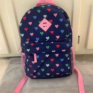 Protege colorful hearts on blue background backpack with pink accents.